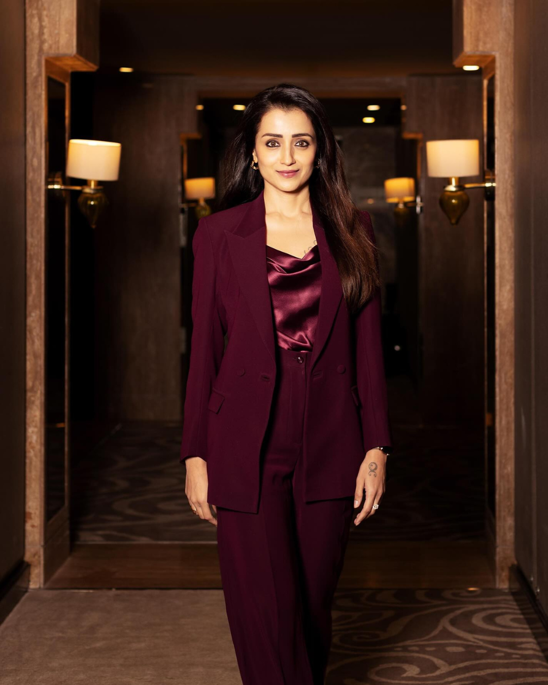 Trisha shines in wine-red suit: Take a look!