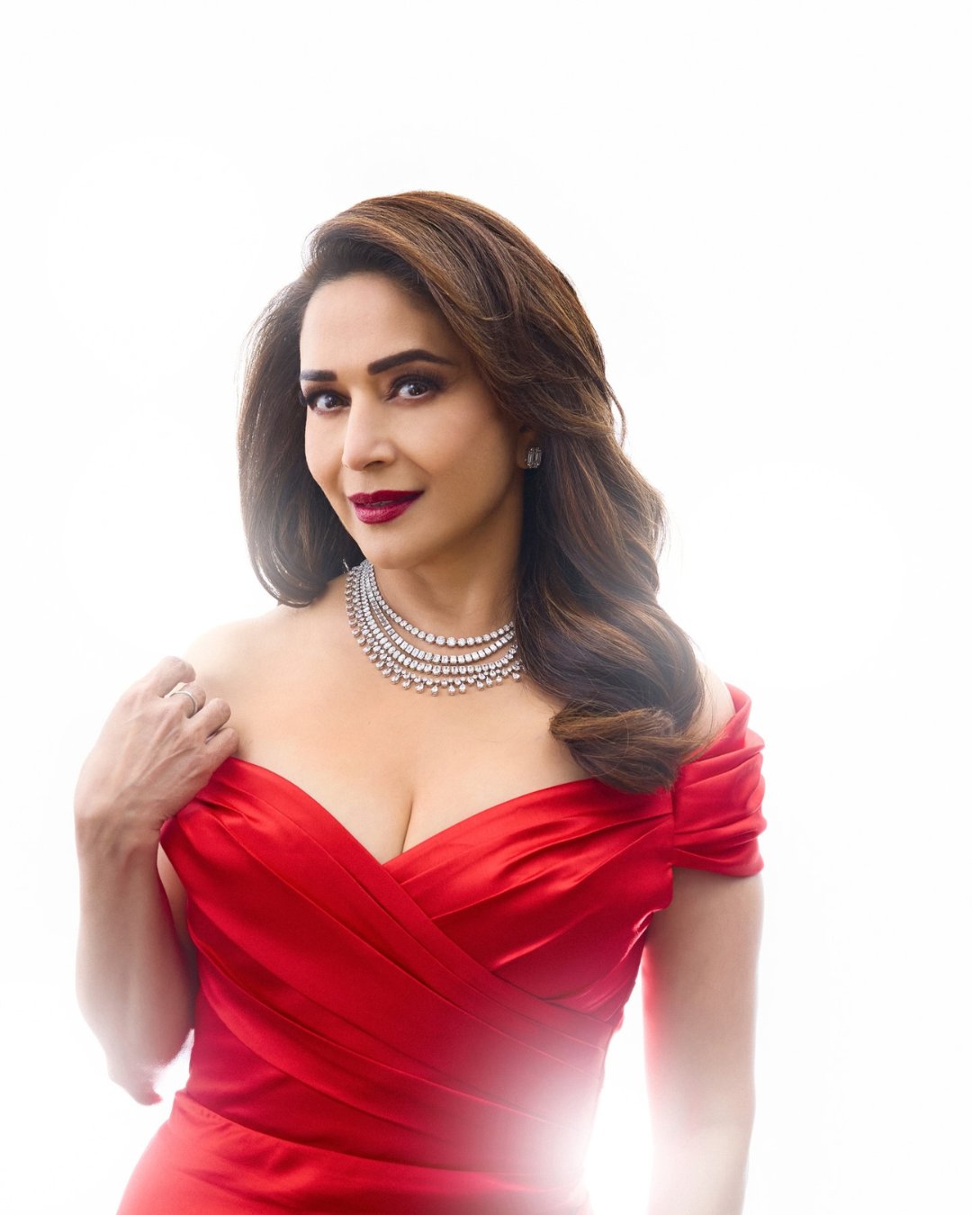 Spot light’s on: Madhuri Dixit strikes a pose in elegant RED!