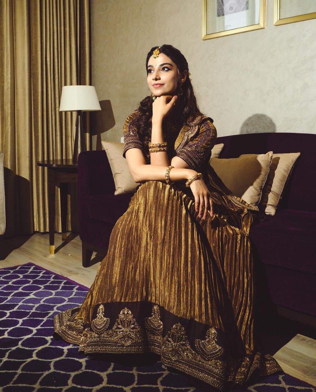 Meenakshi Chaudhary looks like a diva in golden saree