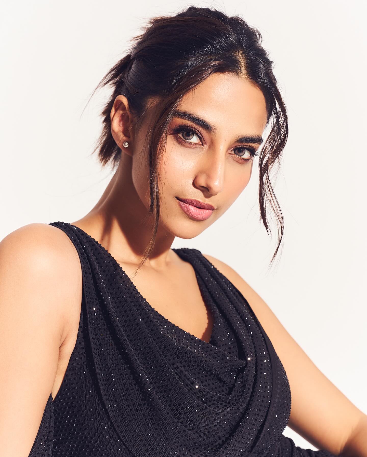 Meenakshi Chaudhary Turns Up Heat in Stunning Black Mini Dress